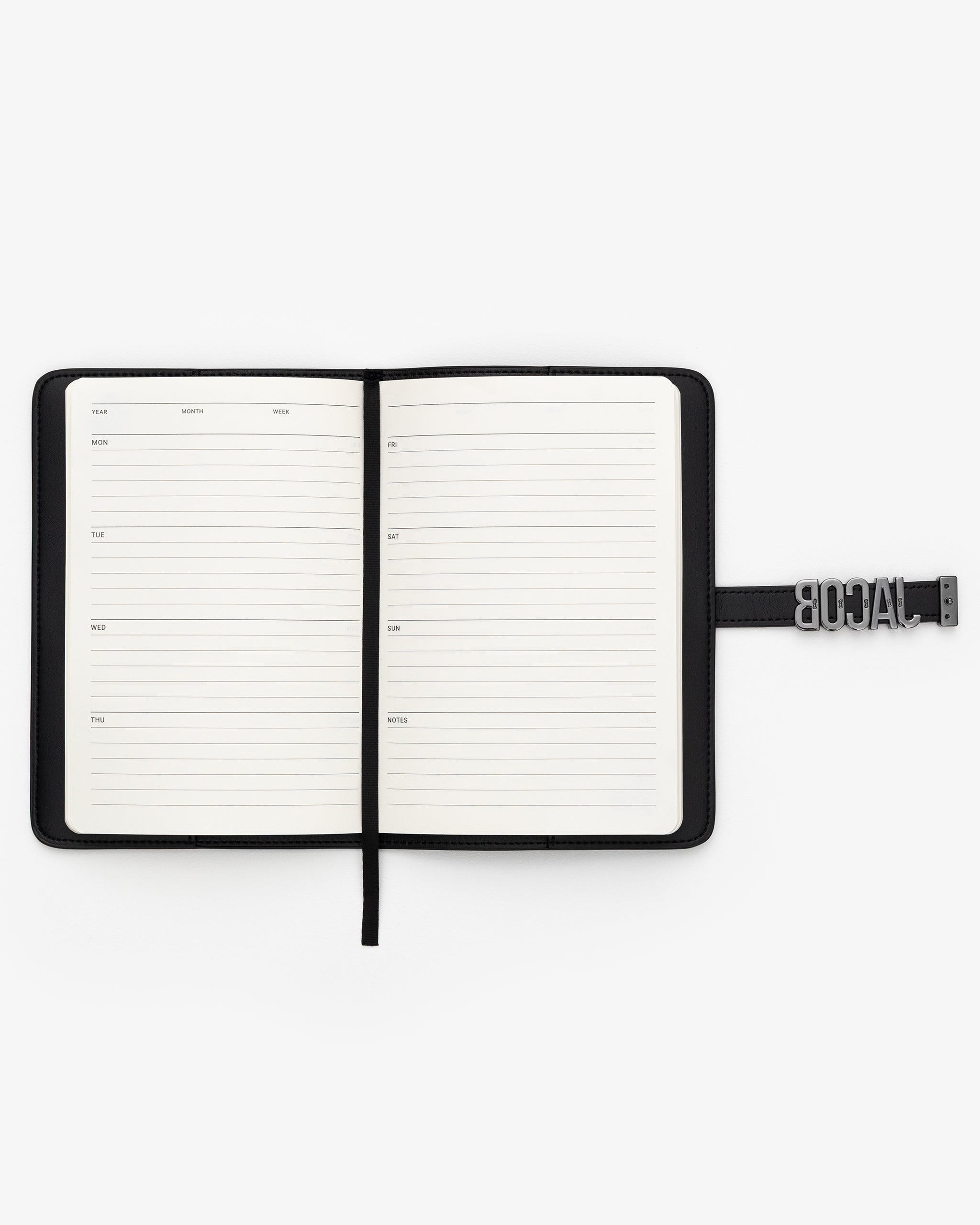 Open notebook with weekly planner on a white background