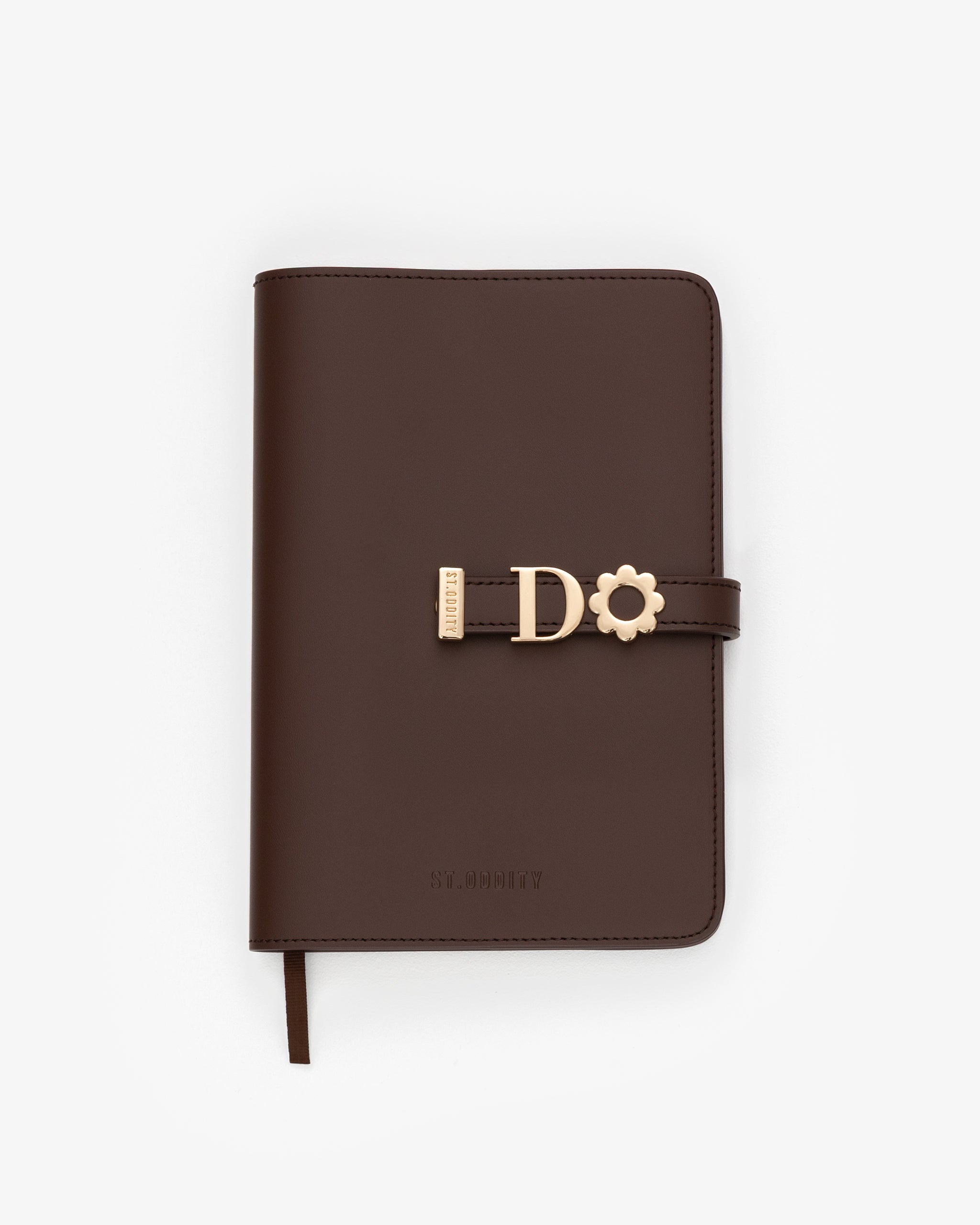 Brown notebook with gold clasp on a white background