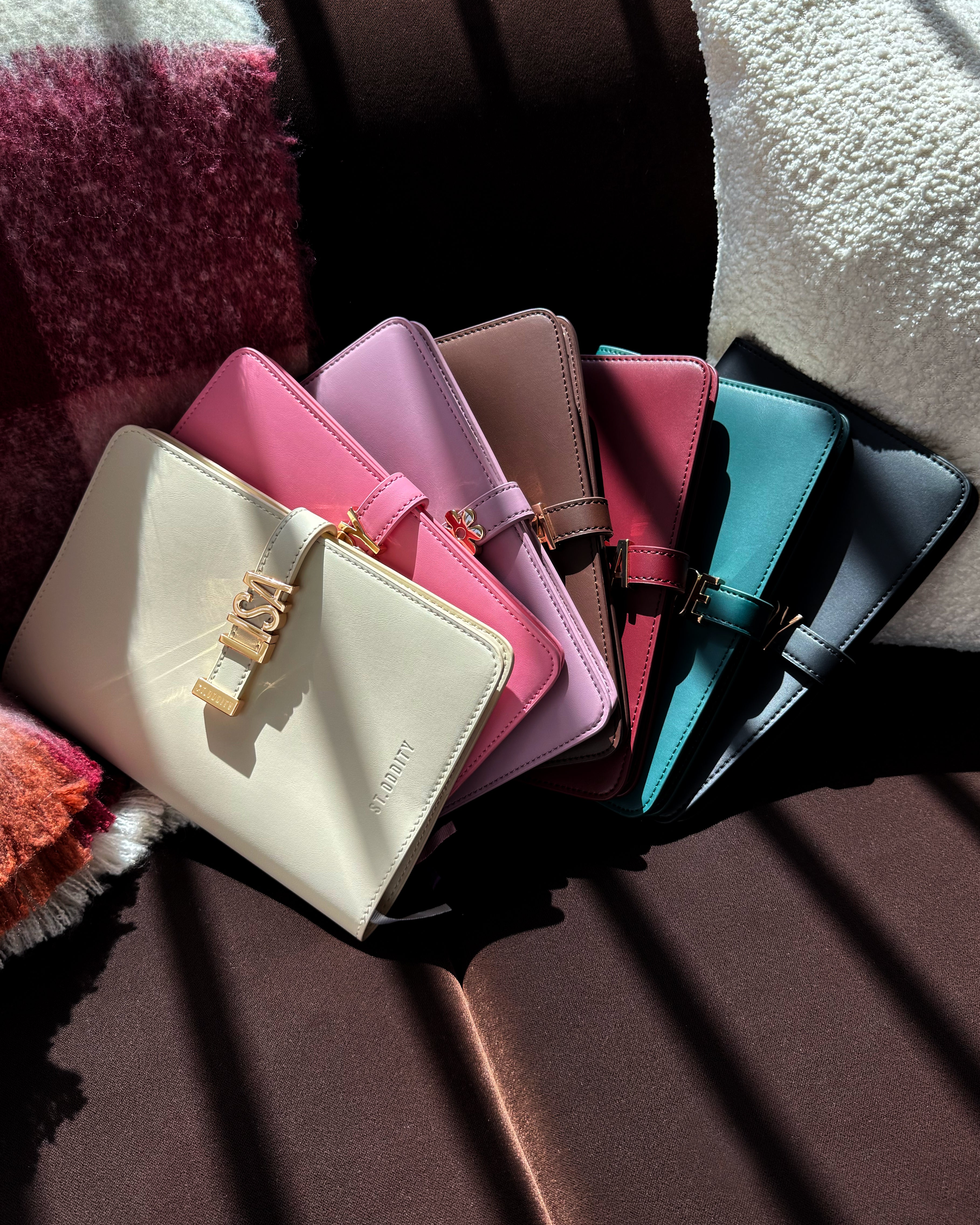 Collection of colourful notebooks arranged on a textured surface