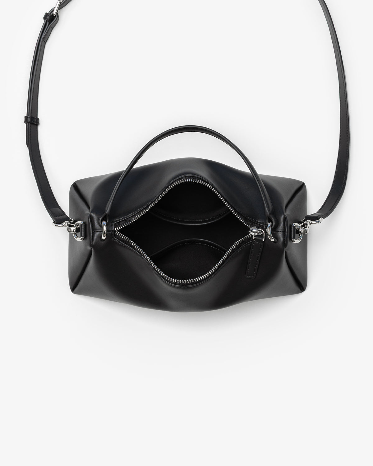 A black leather handbag shown from a top-down view with its front zipper open, revealing the interior. The bag features a structured, rounded rectangular shape, a top handle, and a thin shoulder strap, set against a plain white background.