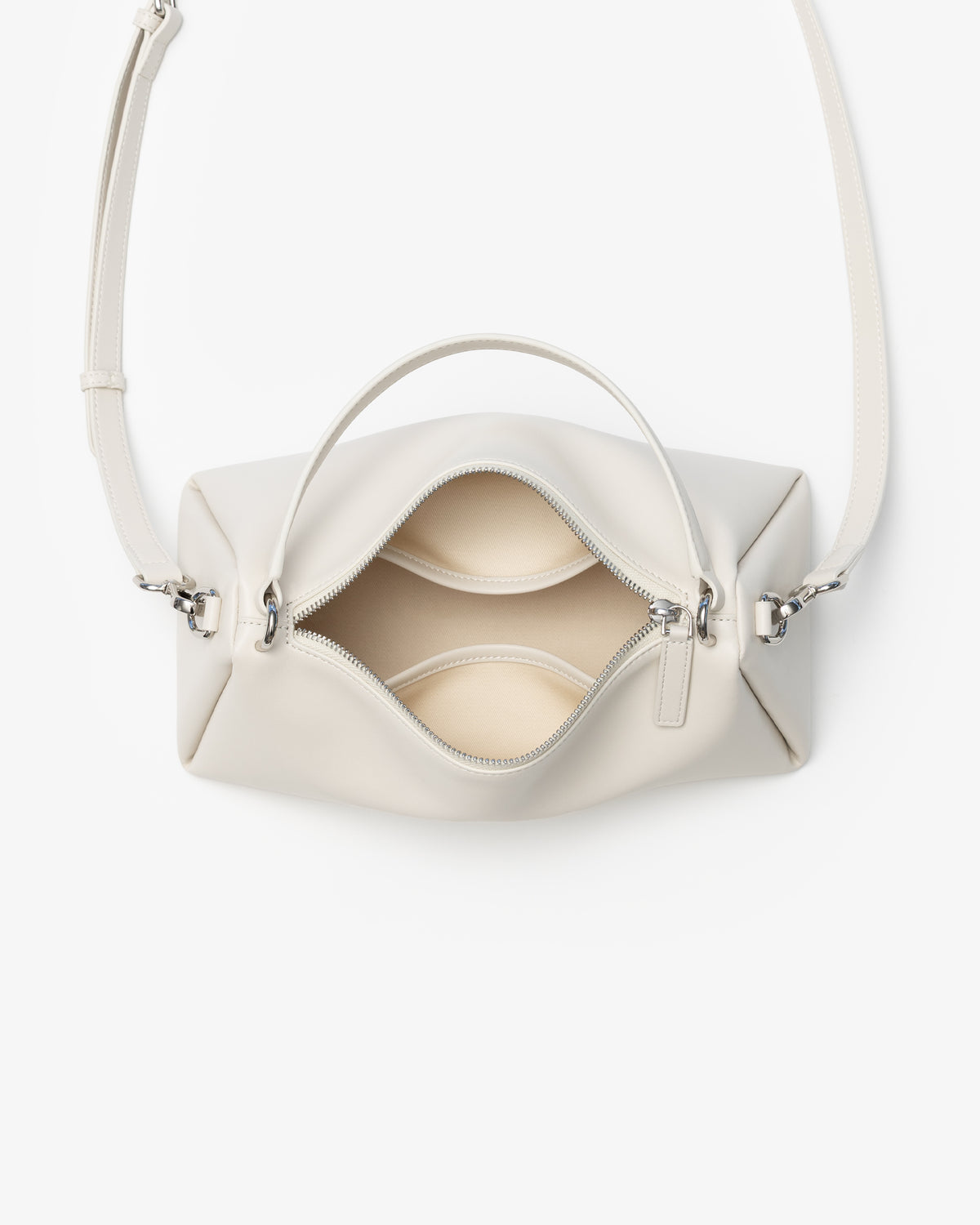 An off-white leather handbag with a top handle and shoulder strap, shown from a top-down view with the front zipper open, on a clean white background.