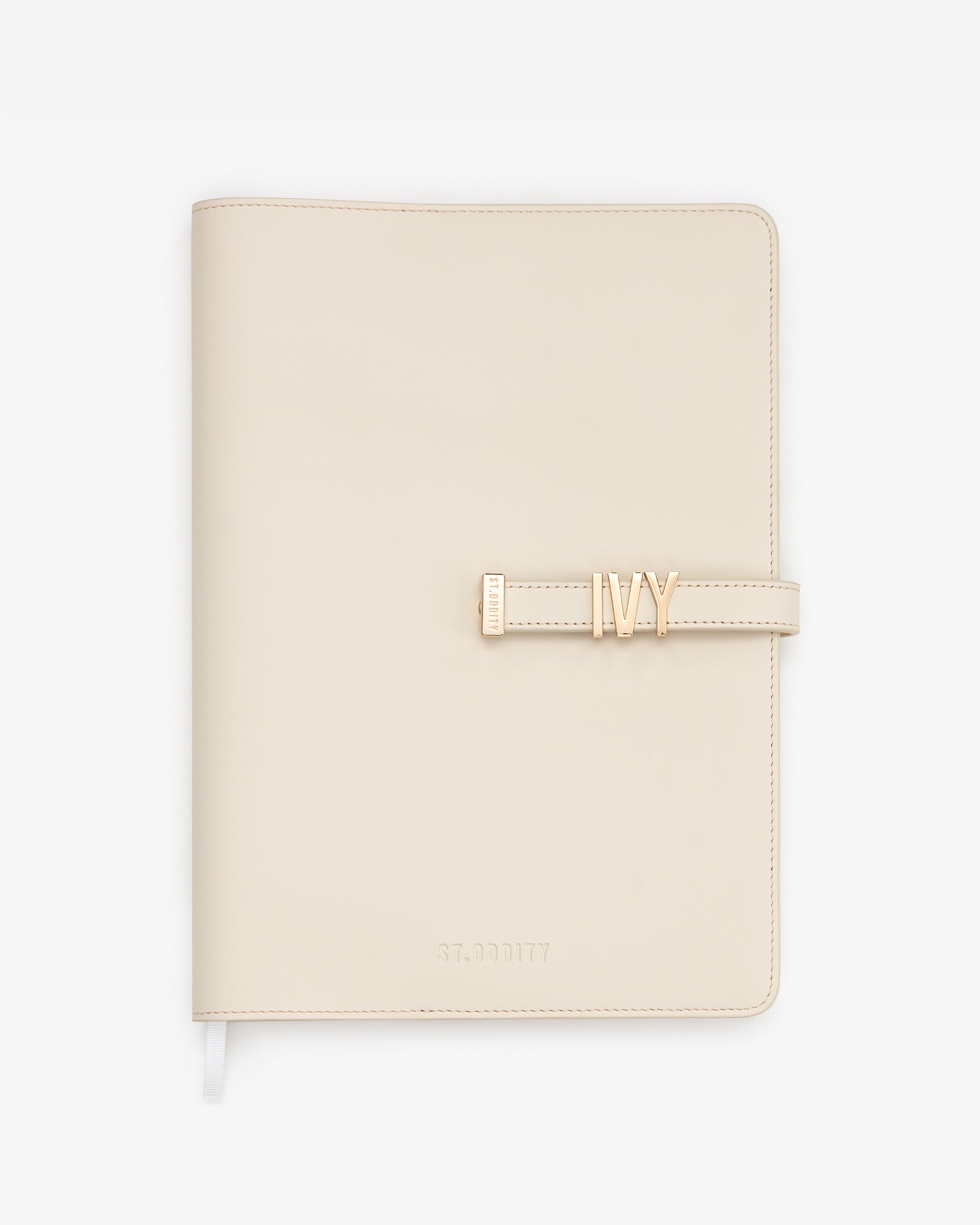Off white A4 Notebook personalised with 'IVY' in gold hardware on a white background.
