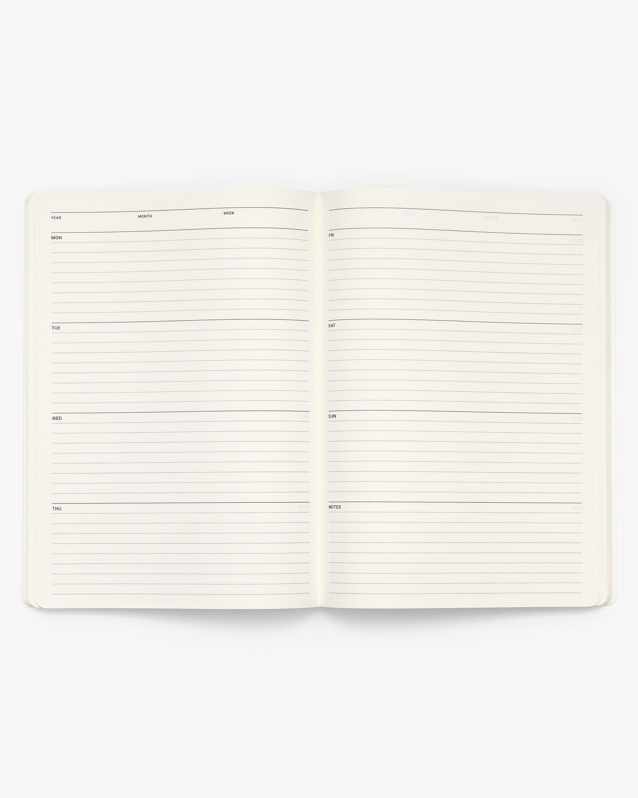 Open A4 notebook weekly planner on a white background