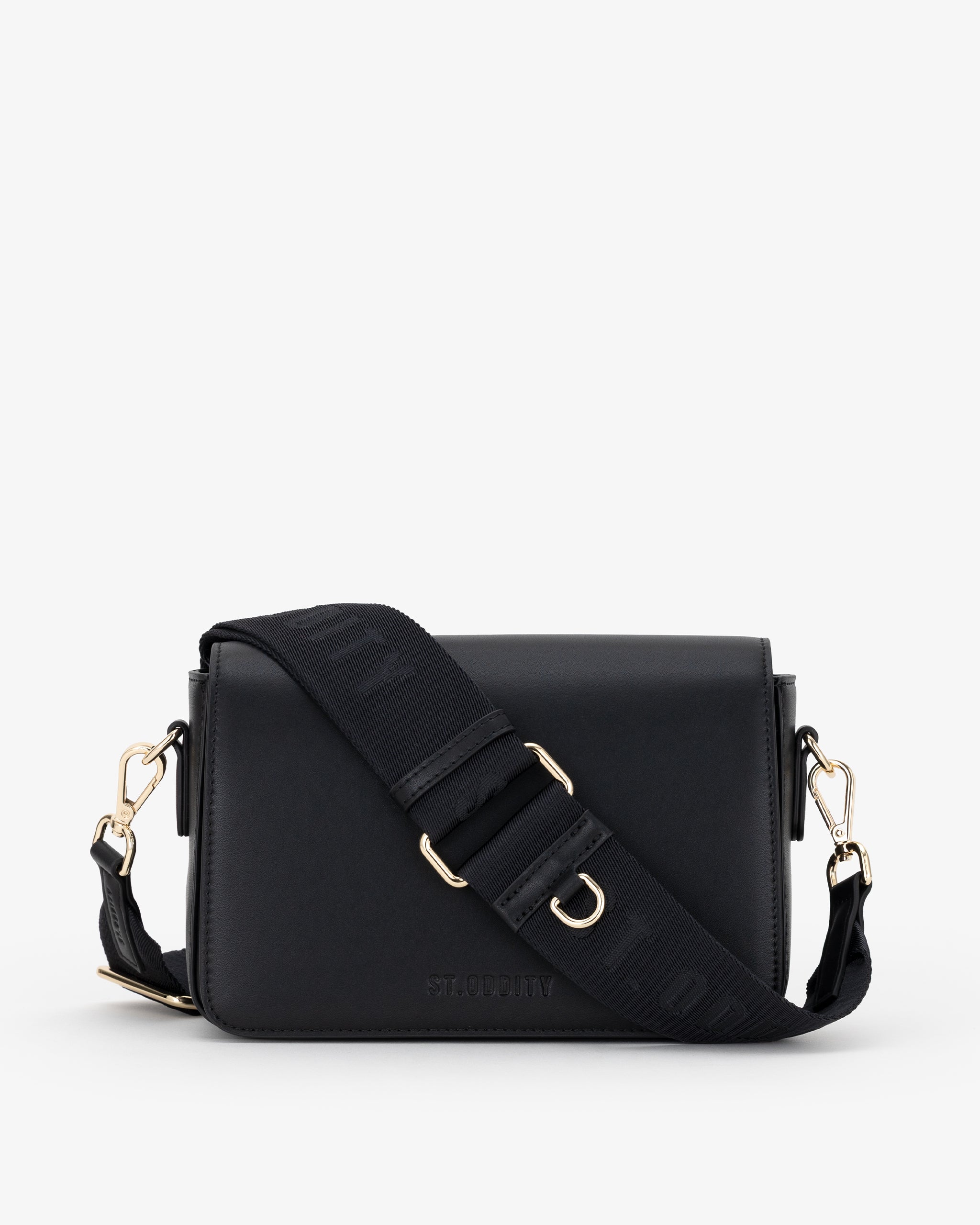 Black crossbody bag with gold accents on a white background
