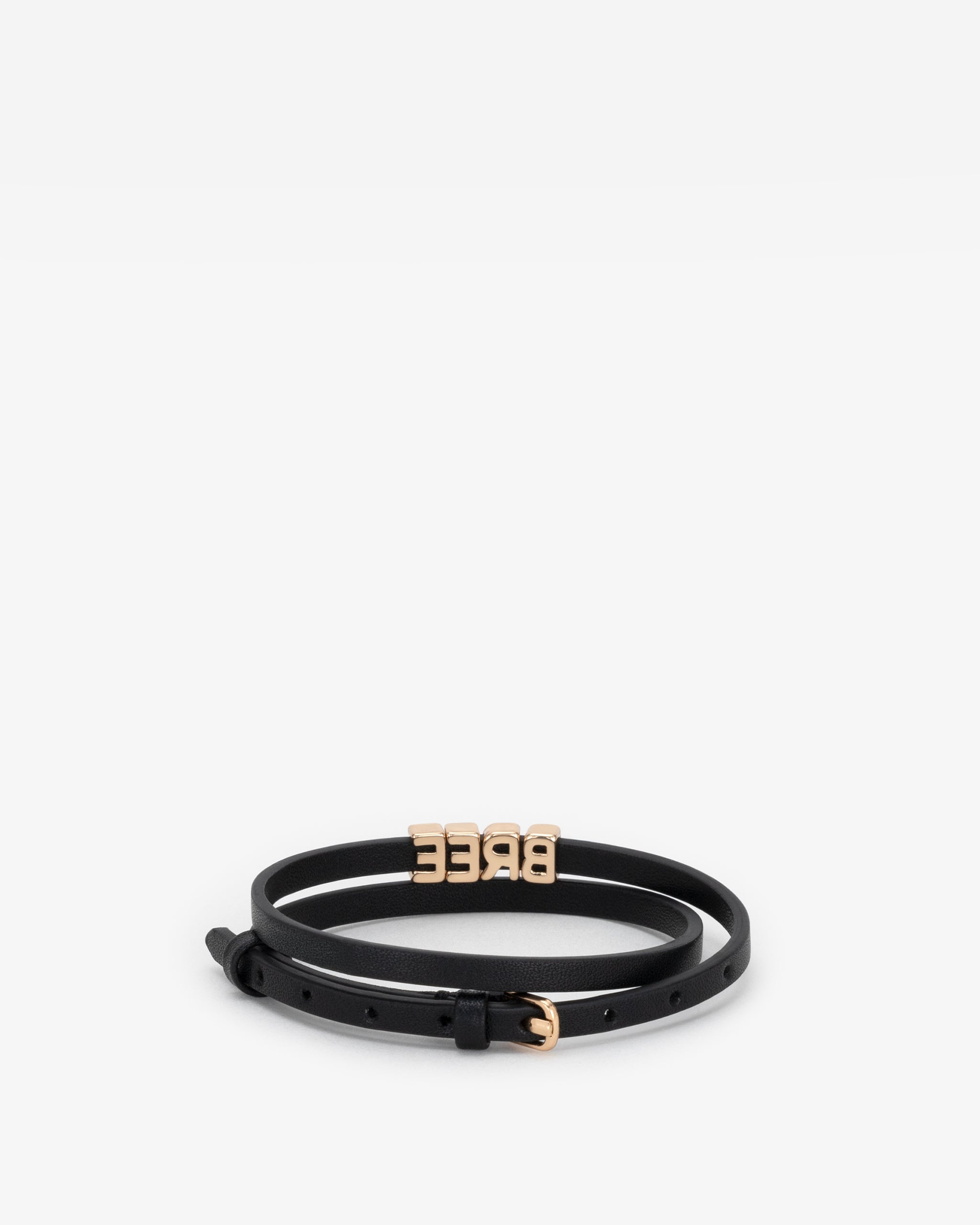 Black vegan leather bracelet with 'BREE' in gold letter personalisation on a white background.