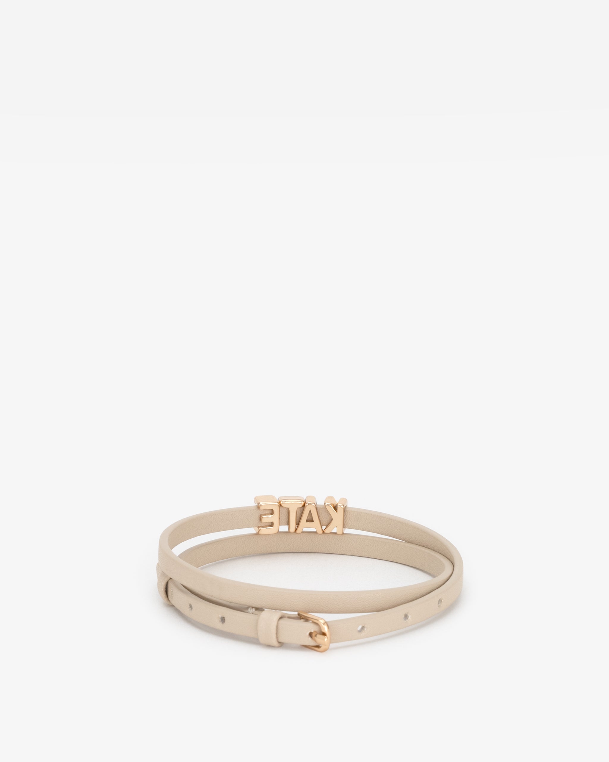 Beige vegan leather bracelet with 'KATE' in gold letter personalisation on a white background.