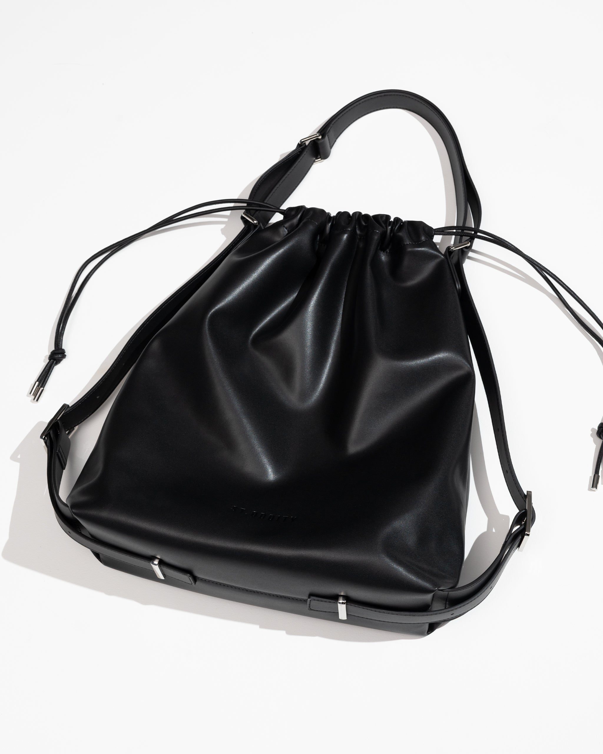 Black drawstring bag on a white background
