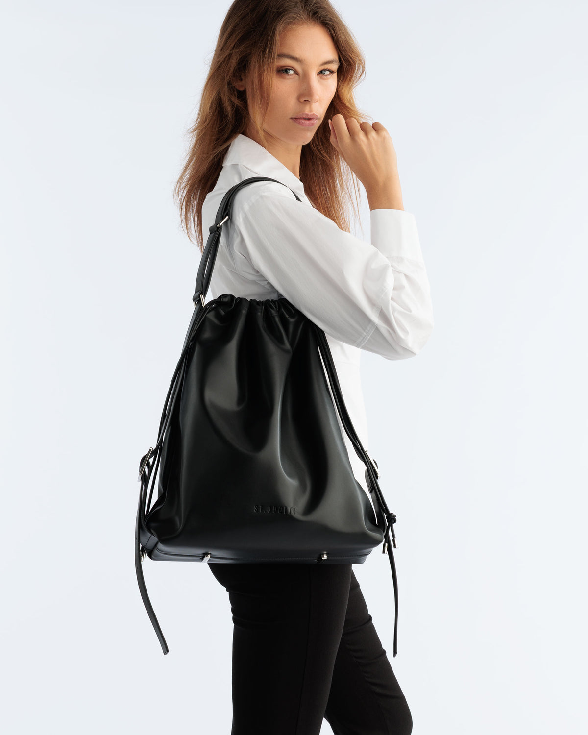 Model carrying the Drawstring Tote