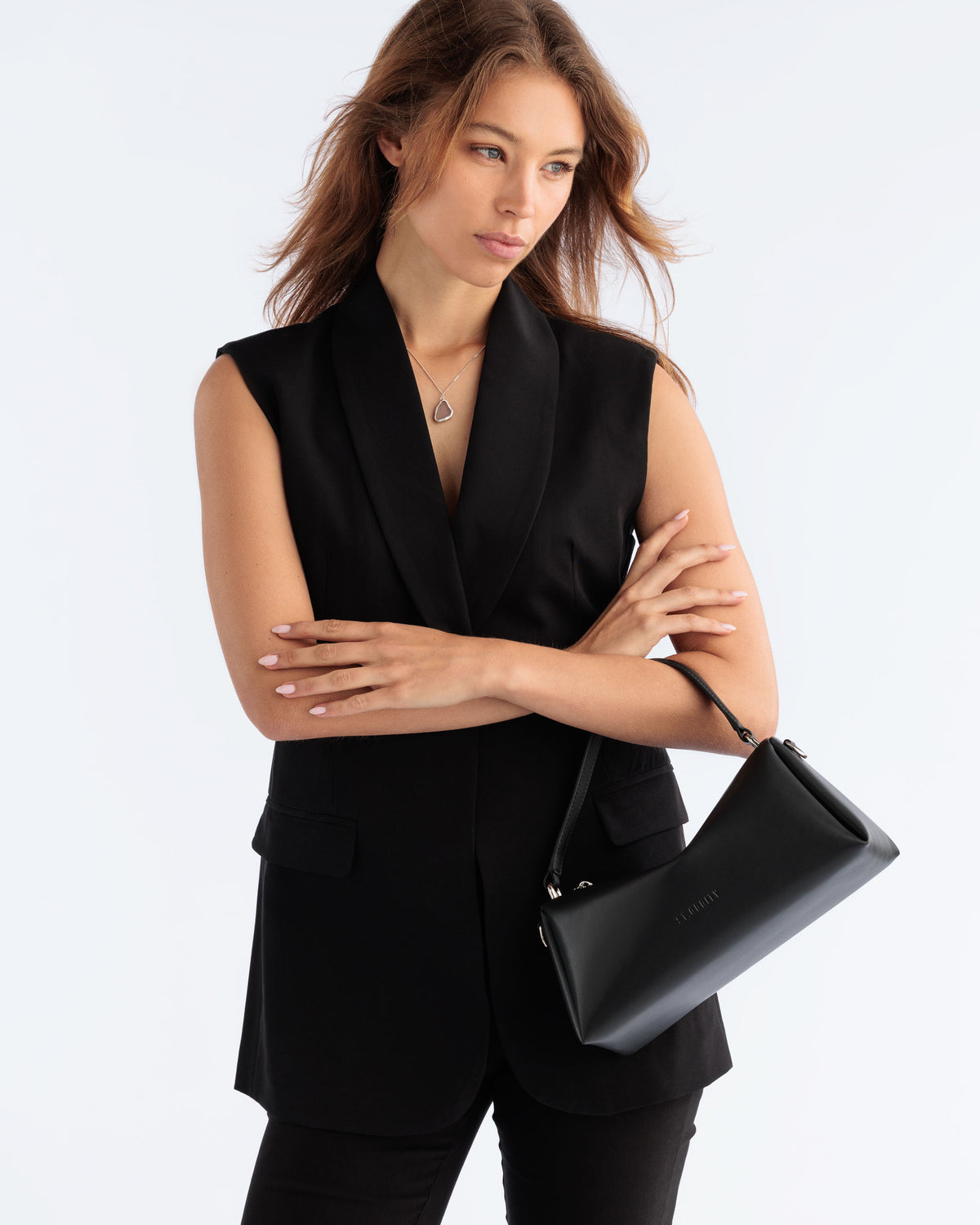Model wearing the Kit Crossbody Bag in Black