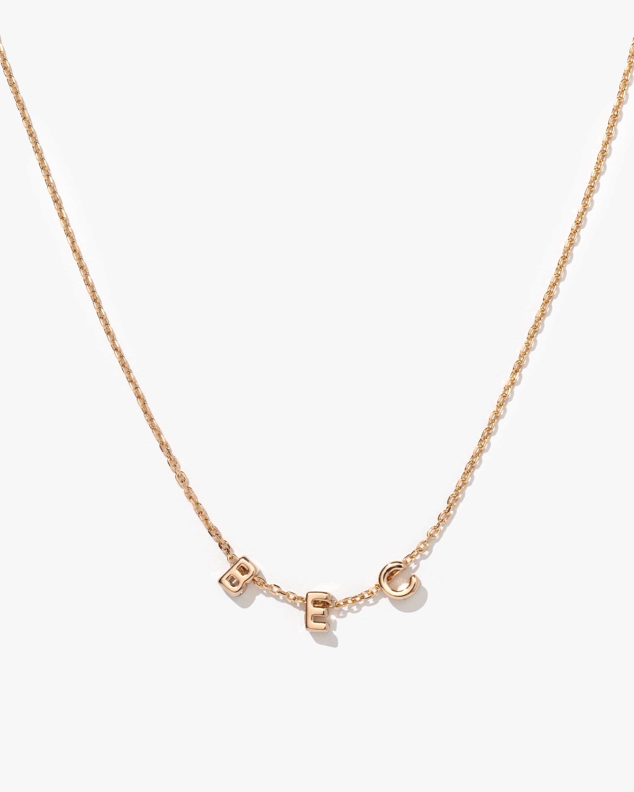Gold fine chain necklace with 'BEC' personalised on it