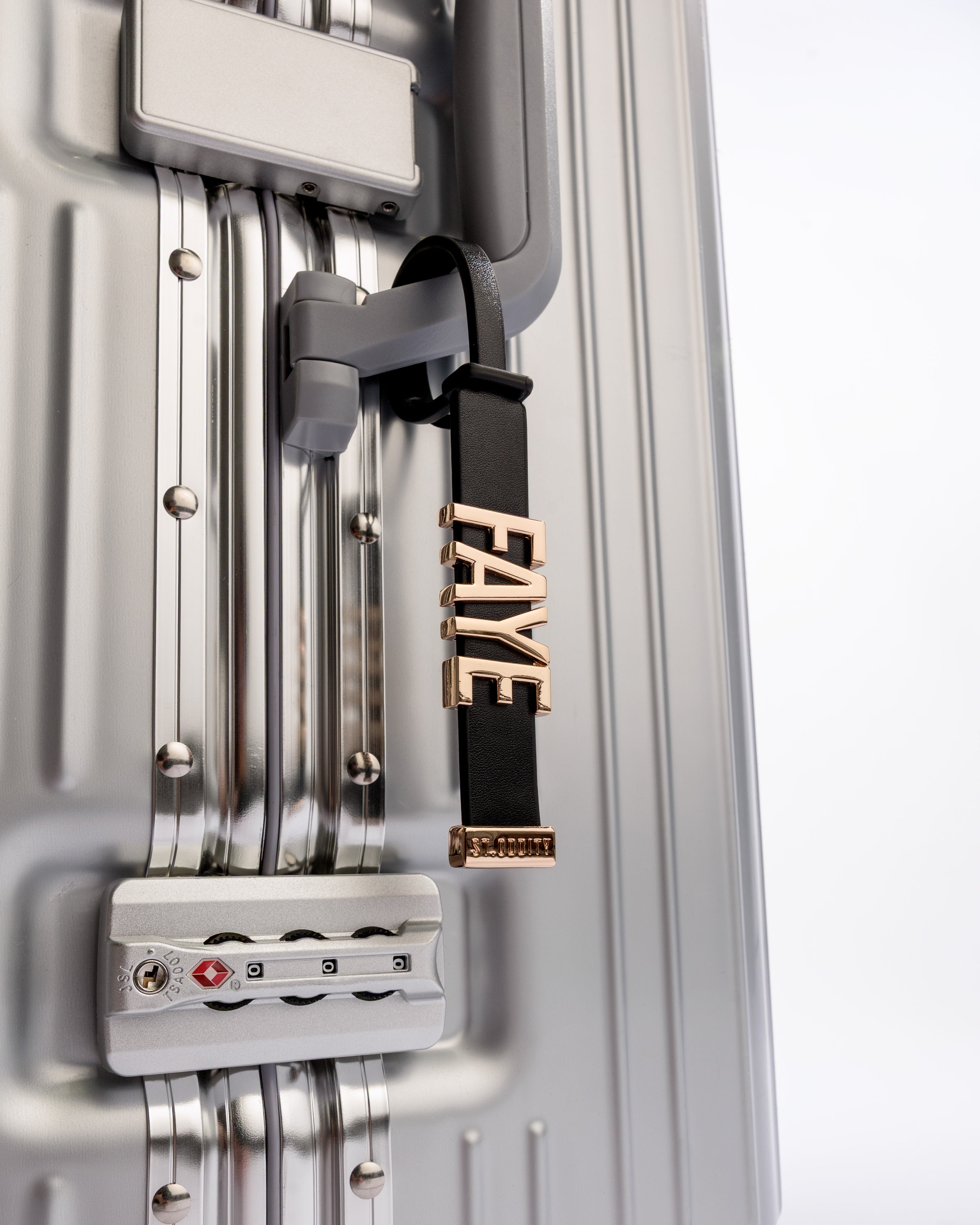 Luggage Tag in Black/Gold on Silver Luggage