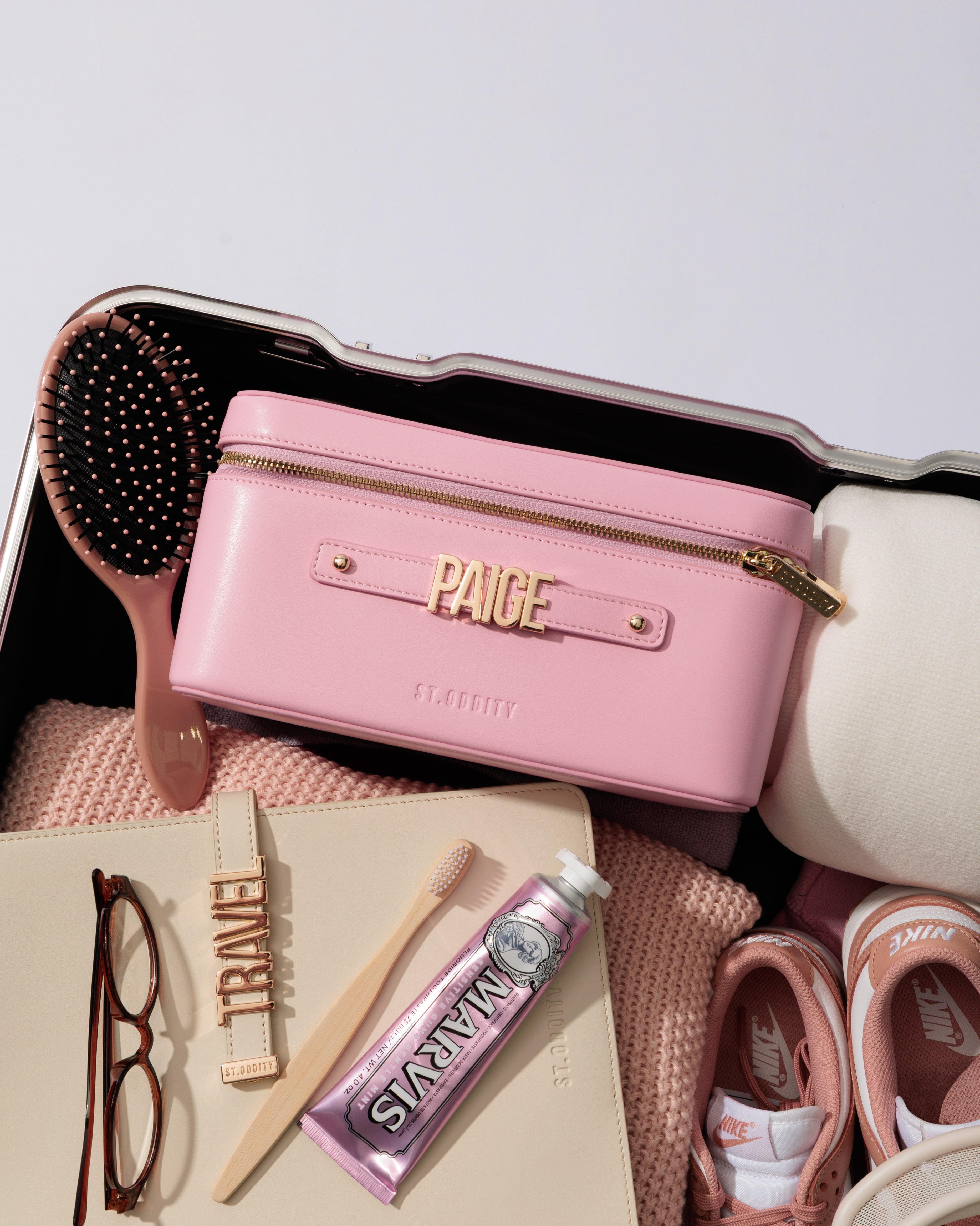 Pink makeup case with 'PAIGE' personalisation on a white background