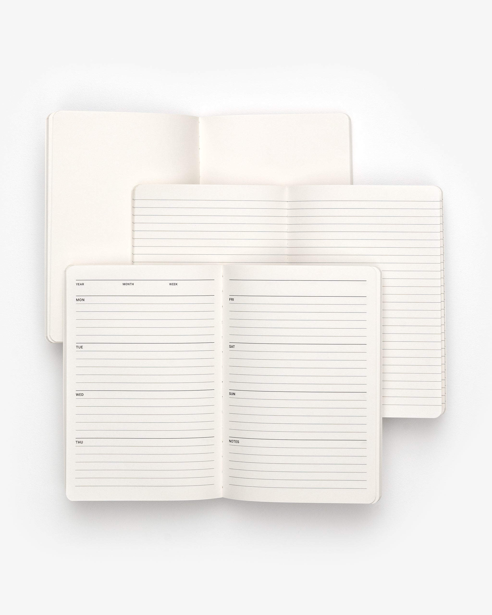 White notebook with lined pages on a white background