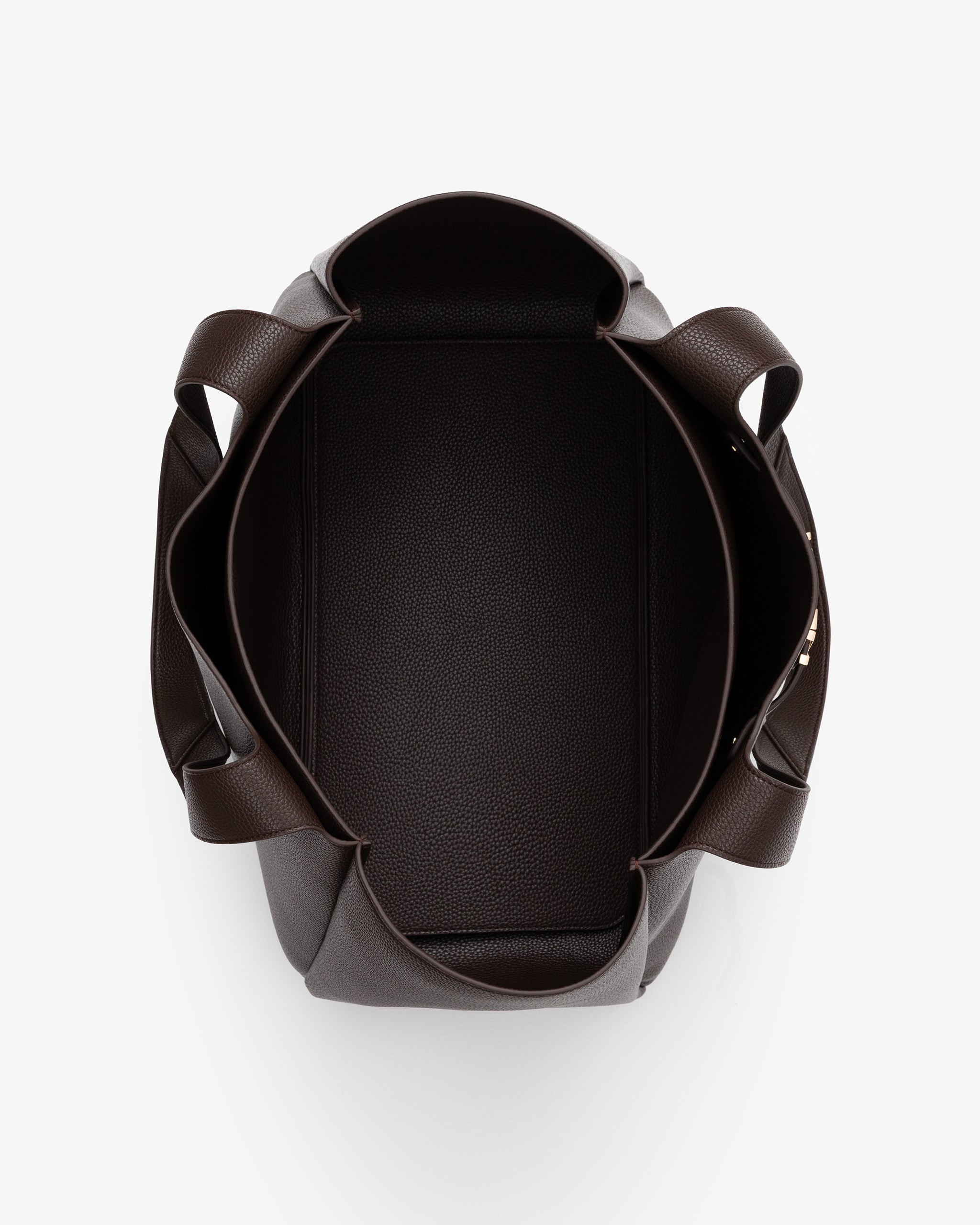 Open brown handbag on a white background