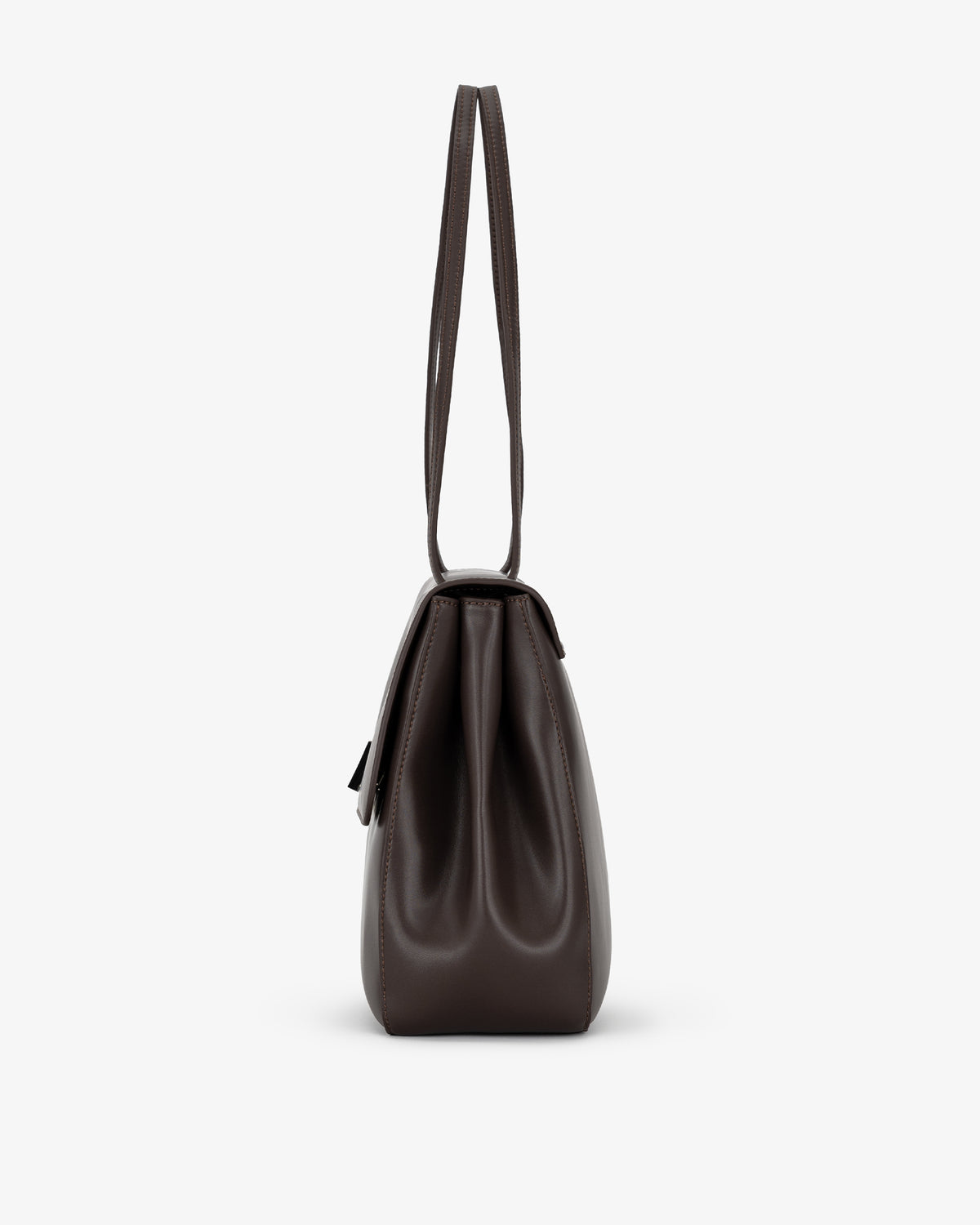 A dark brown leather shoulder bag shown from the back, featuring a single long strap and a structured silhouette, set against a plain light gray background.