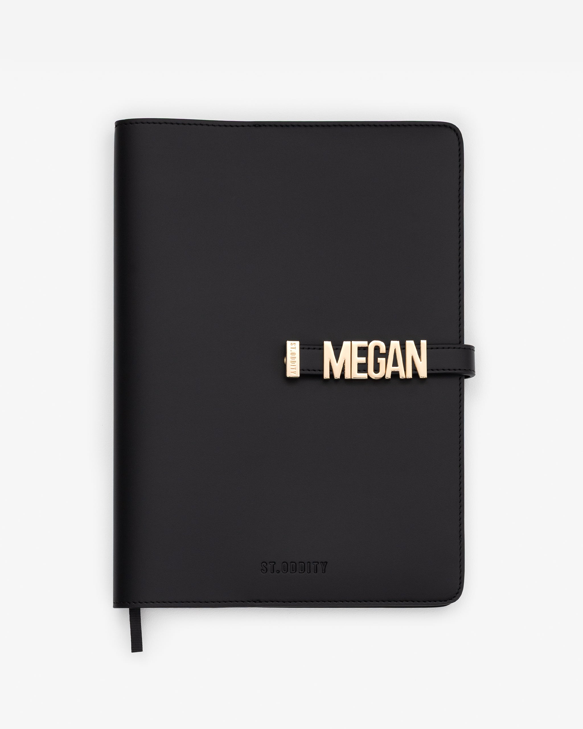 Black/Gold A4 Notebook with 'MEGAN' gold personalisation on a white background.