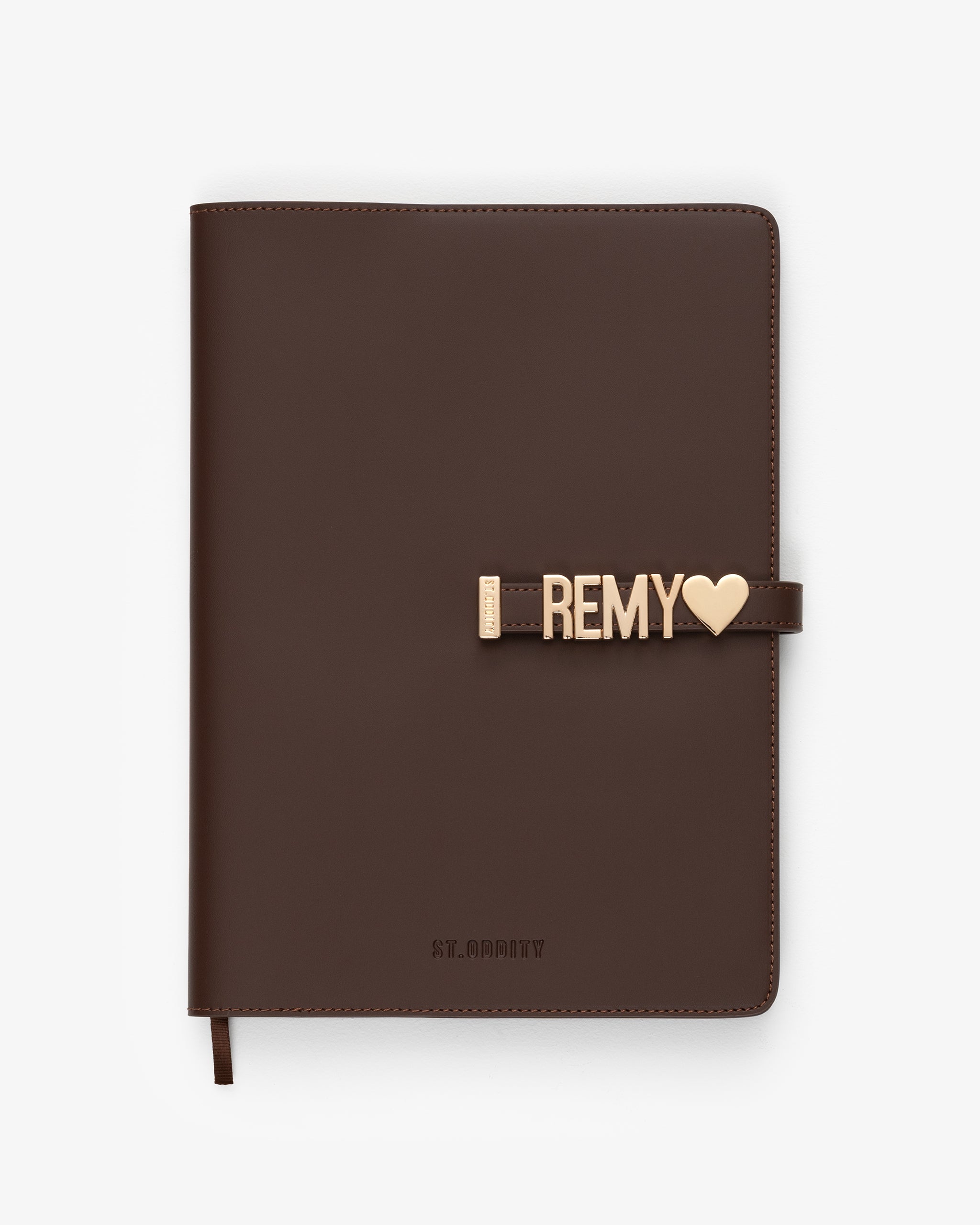 A4 Brown notebook with 'REMY' personalisation on a white background