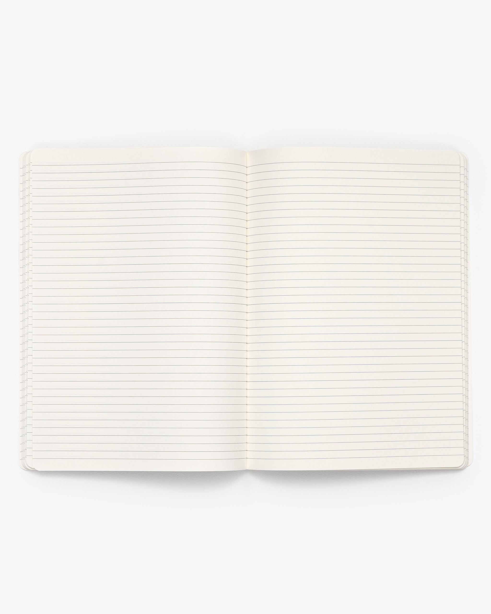 Open A4 notebook with white lined pages on a white background