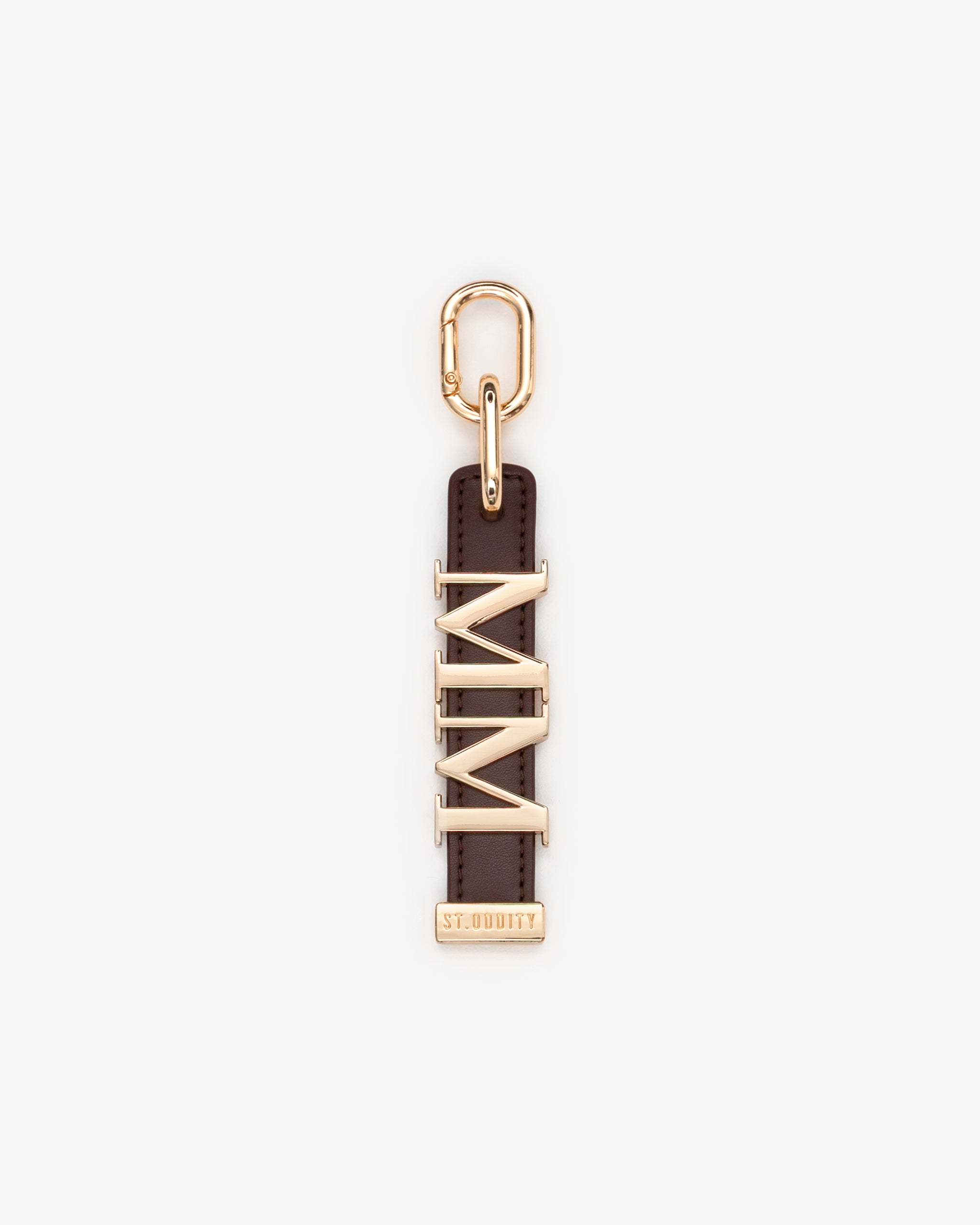 Brown charm with gold personalisation 'MM' on a white background