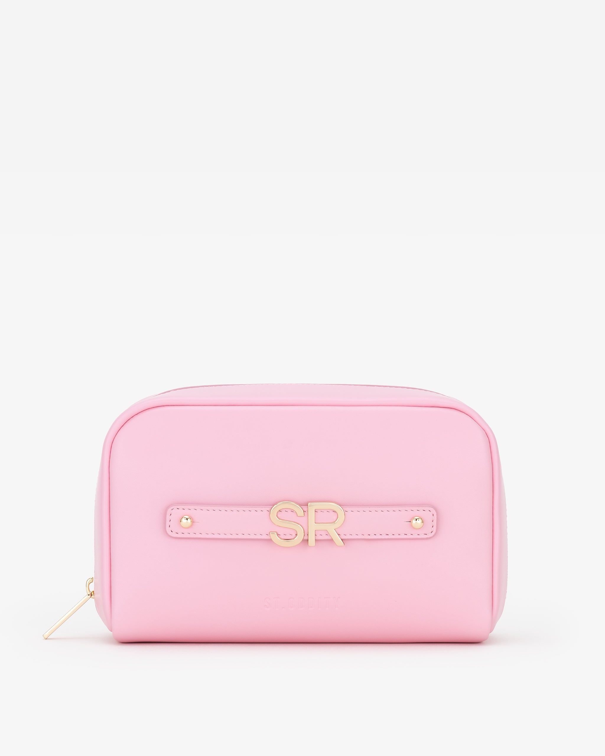 Pink pouch with gold initials on a white background