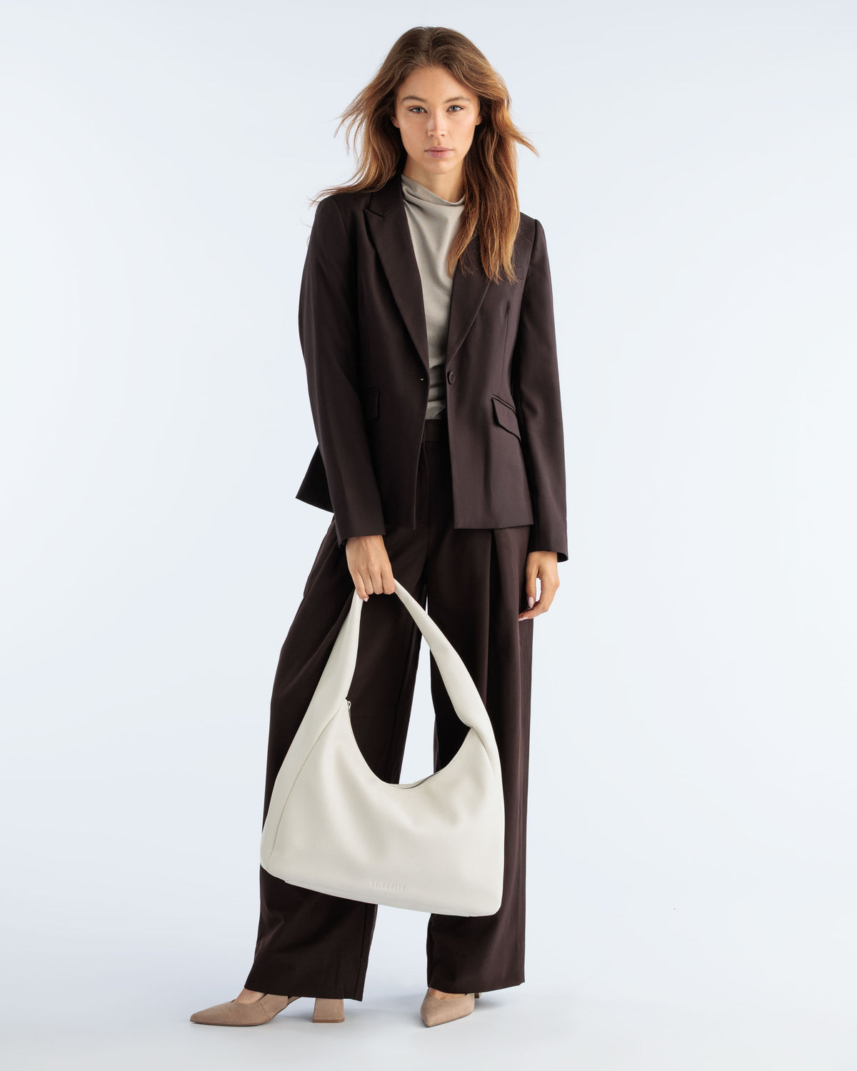 Model carrying the Hobo Bag in Off White