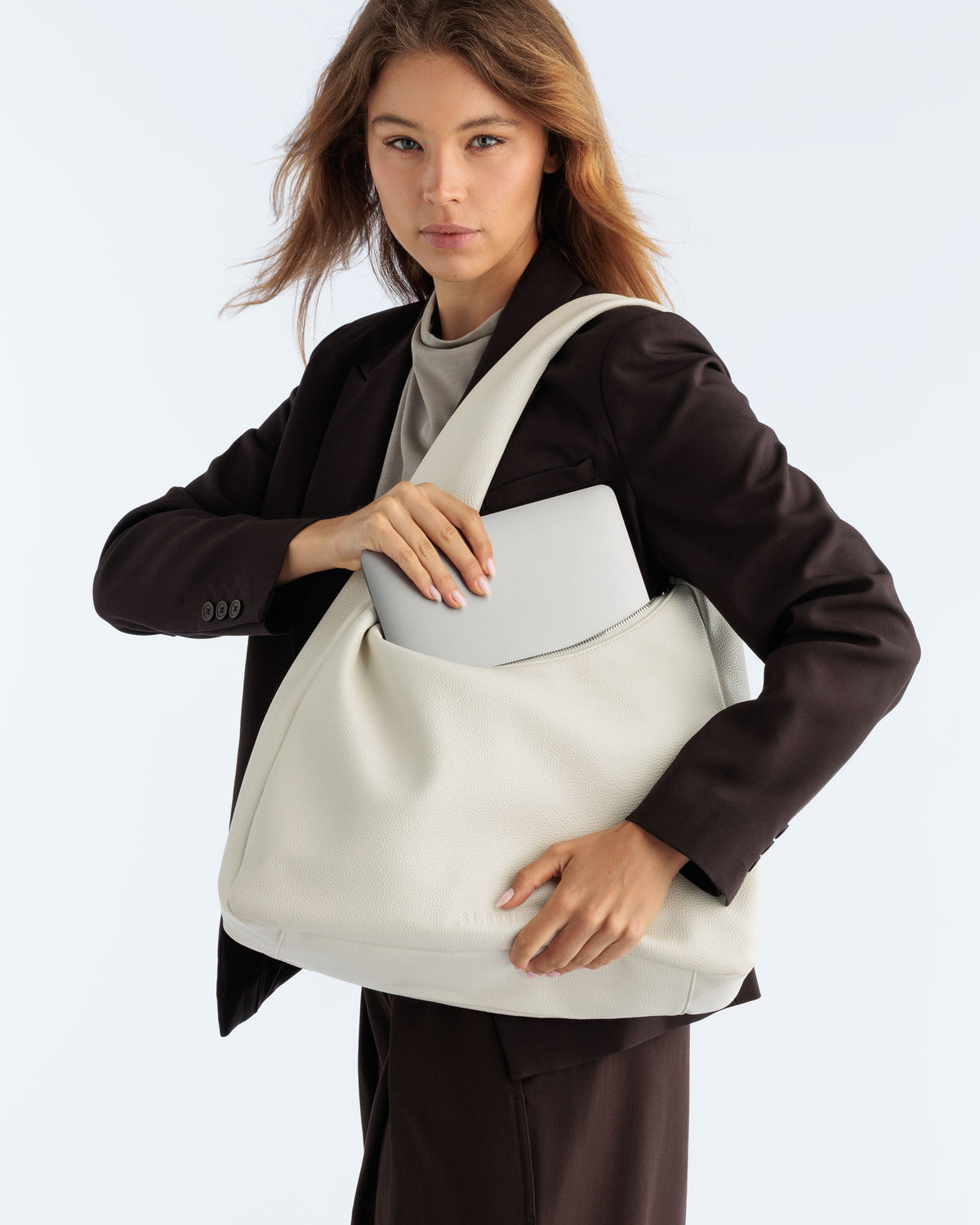 Model carrying the Hobo Bag in Off White