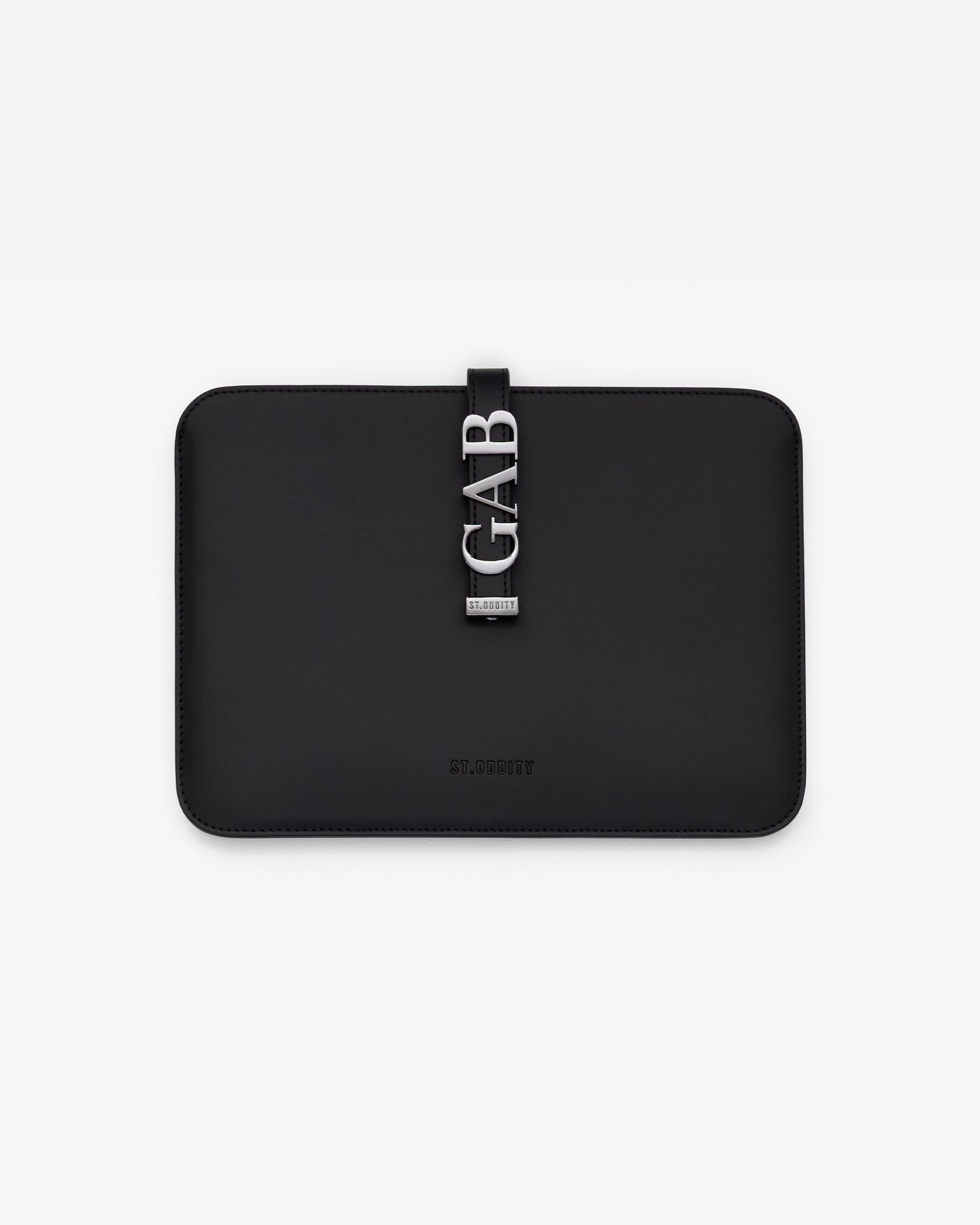 Black iPad sleeve with gunmetal personalisation 'GAB' on a white background