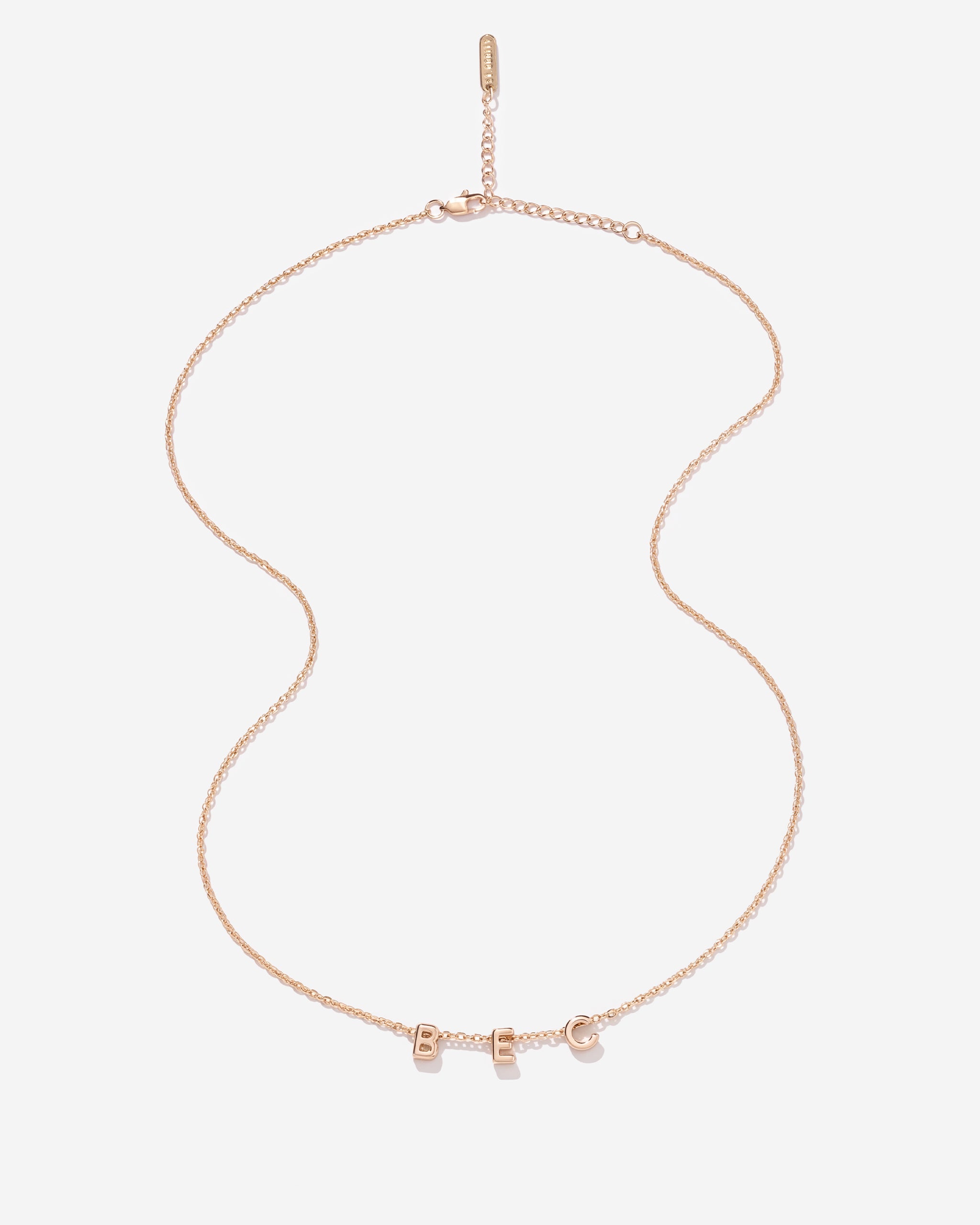 Gold fine chain necklace with 'BEC' personalised on it